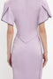 Back view of a person wearing the Gathered V-Neck Midi Dress In Petunia by Victoria Beckham, with short sleeves, waist-defining pleat, and visible seam details.