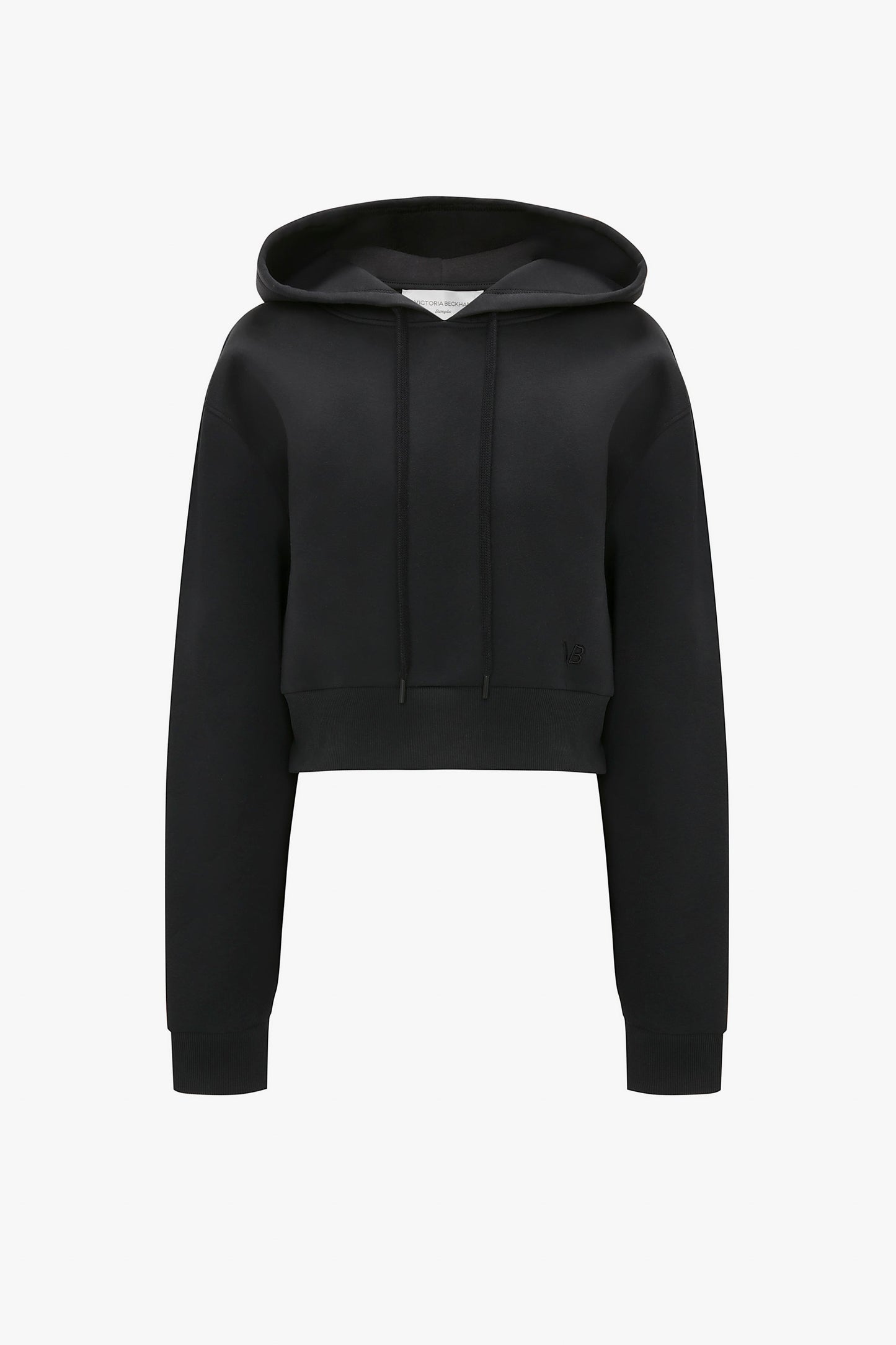 Cropped Neoprene Hoodie In Black by Victoria Beckham with long sleeves, a structured hood, and a fitted hem, displayed against a white background.