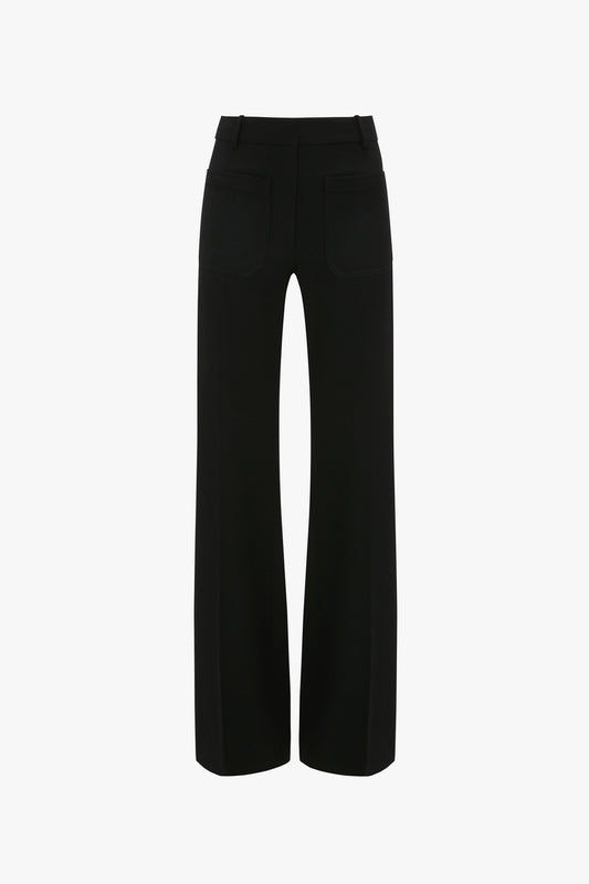 Back view of black high-waisted, wide-leg Alina Tailored Trouser In Black with two rear pockets and belt loops, exuding a 70s style reminiscent of Victoria Beckham's iconic designs by Victoria Beckham.