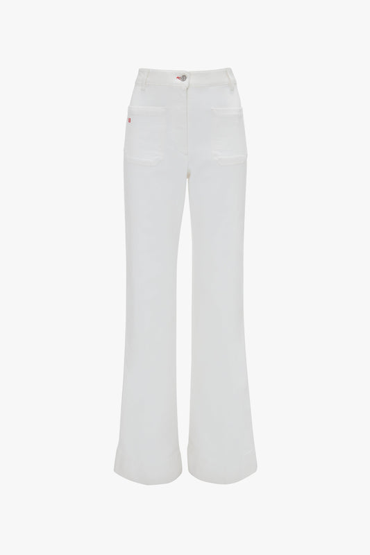 A pair of Alina High Waisted Jean In Washed White by Victoria Beckham with front pockets and a button closure.