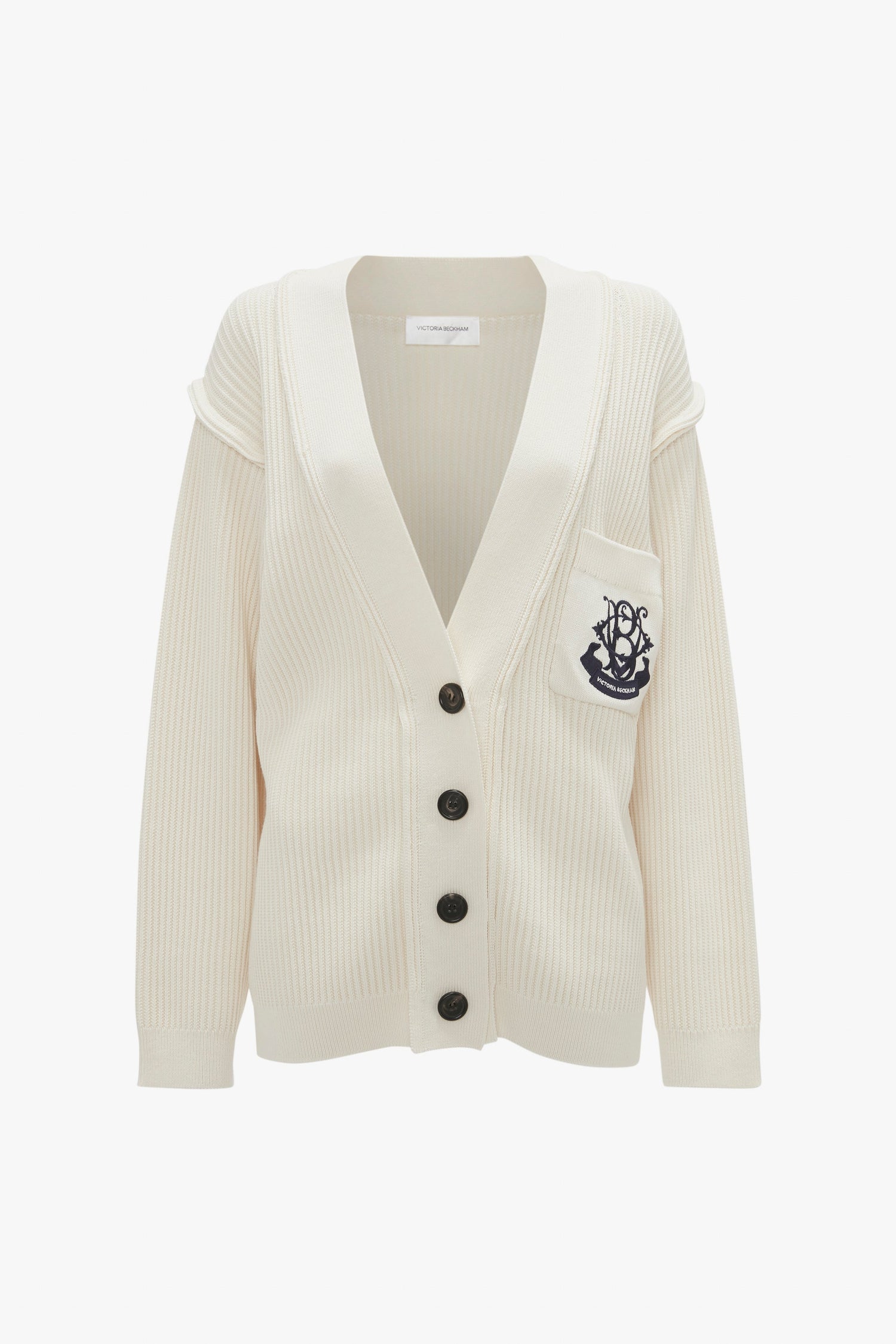 A Relaxed Fit Cardigan In Natural featuring black buttons and an embroidered anchor logo on the front pocket by Victoria Beckham.