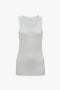 Victoria Beckham's Fine Knit Vertical Stripe Tank in White features a white sleeveless ribbed design with a subtle textured appearance, displayed elegantly on a plain white background.