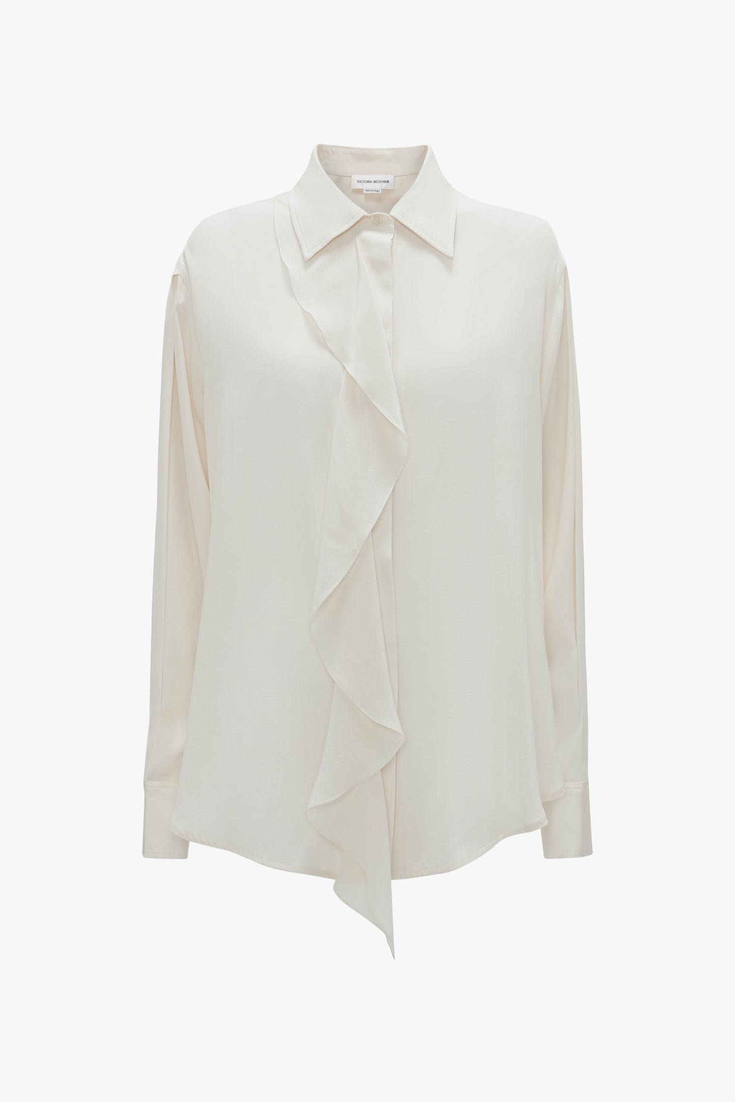 The Asymmetric Ruffle Blouse In Ivory by Victoria Beckham, featuring a ruffled front detail, classic collar, and voluminous sleeves, exudes timeless elegance.