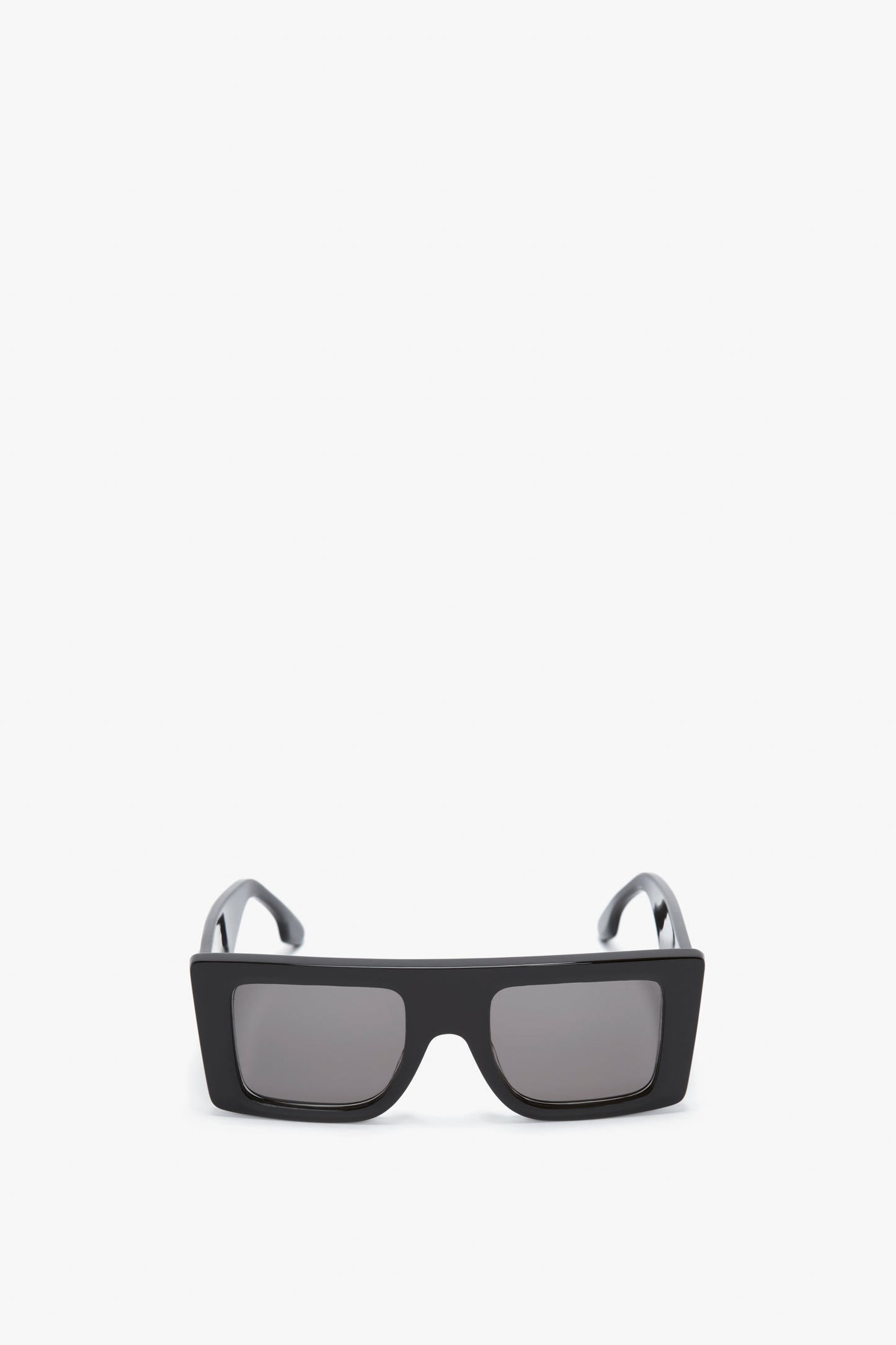 A pair of Victoria Beckham Oversized Frame Sunglasses In Black with dark lenses and a bold oversized frame on a white background.