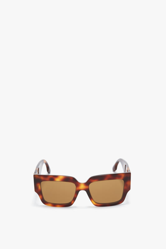 A pair of Victoria Beckham V Plaque Rectangular Frame Sunglasses In Tortoise with brown lenses.