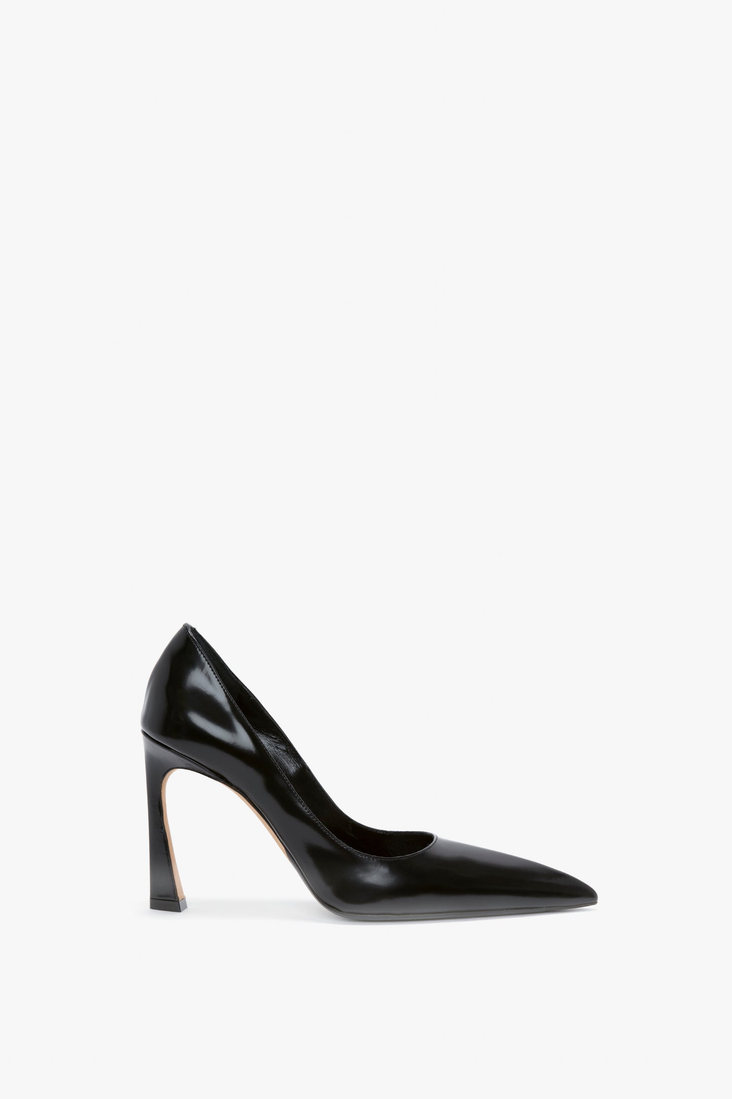 A single V Pump In Black Brushed Leather by Victoria Beckham with a pointed toe and glossy finish, featuring a sculptural heel that adds an artistic touch, displayed against a plain white background.