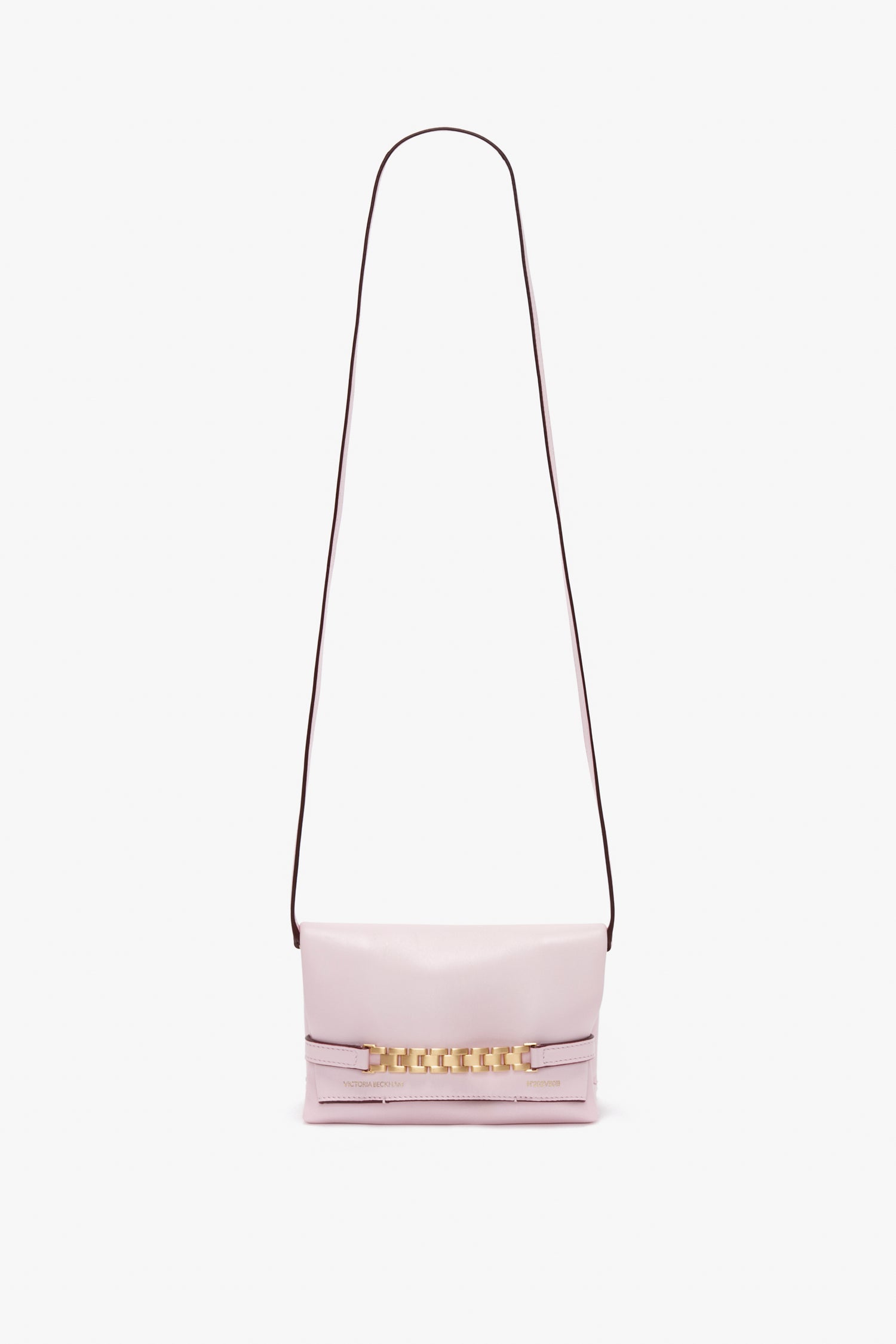 A Mini Chain Pouch Bag With Long Strap In Orchid Leather by Victoria Beckham, set against a white background.