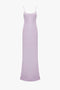 A plain light purple Low Back Cami Floor-Length Dress in Petunia from Victoria Beckham, with spaghetti straps and a slight flare at the hem, displayed against a white background.