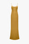 Victoria Beckham Low Back Cami Floor-Length Dress in Harvest Gold with spaghetti straps and a straight neckline, displayed on a plain white background.