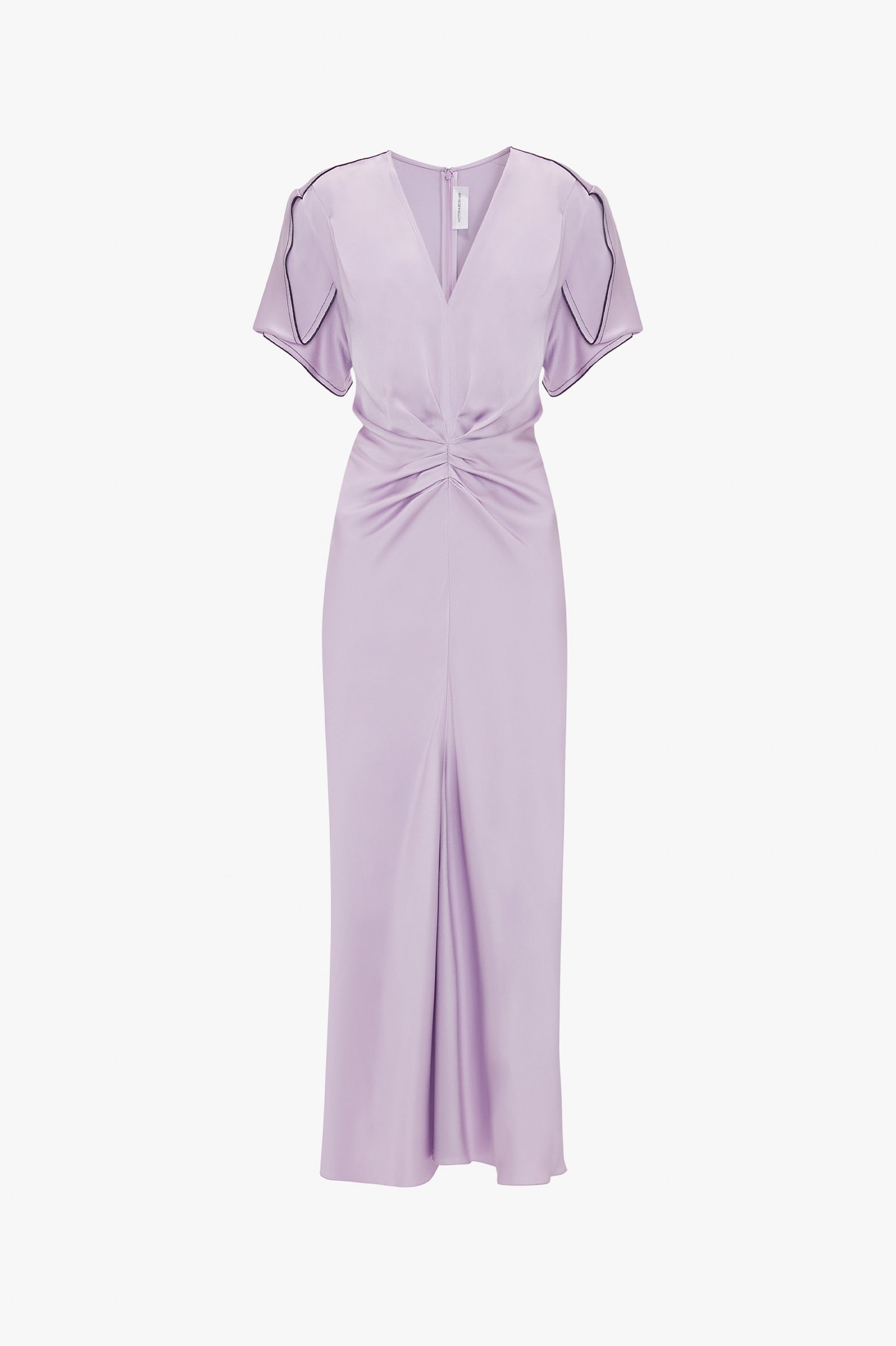 Sure, here is the revised sentence:

A lavender-colored, short-sleeve midi dress with a V-neck and waist-defining pleat detail. The Gathered V-Neck Midi Dress In Petunia by Victoria Beckham features an ankle-length front slit and dark piping accents on the sleeves.