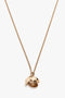 A Victoria Beckham Exclusive Camellia Flower Necklace In Gold featuring a gold chain with a pendant resembling a partially opened flower bud, revealing a textured, gold-toned interior. Expertly handcrafted with gold brushed brass for an elegant touch.