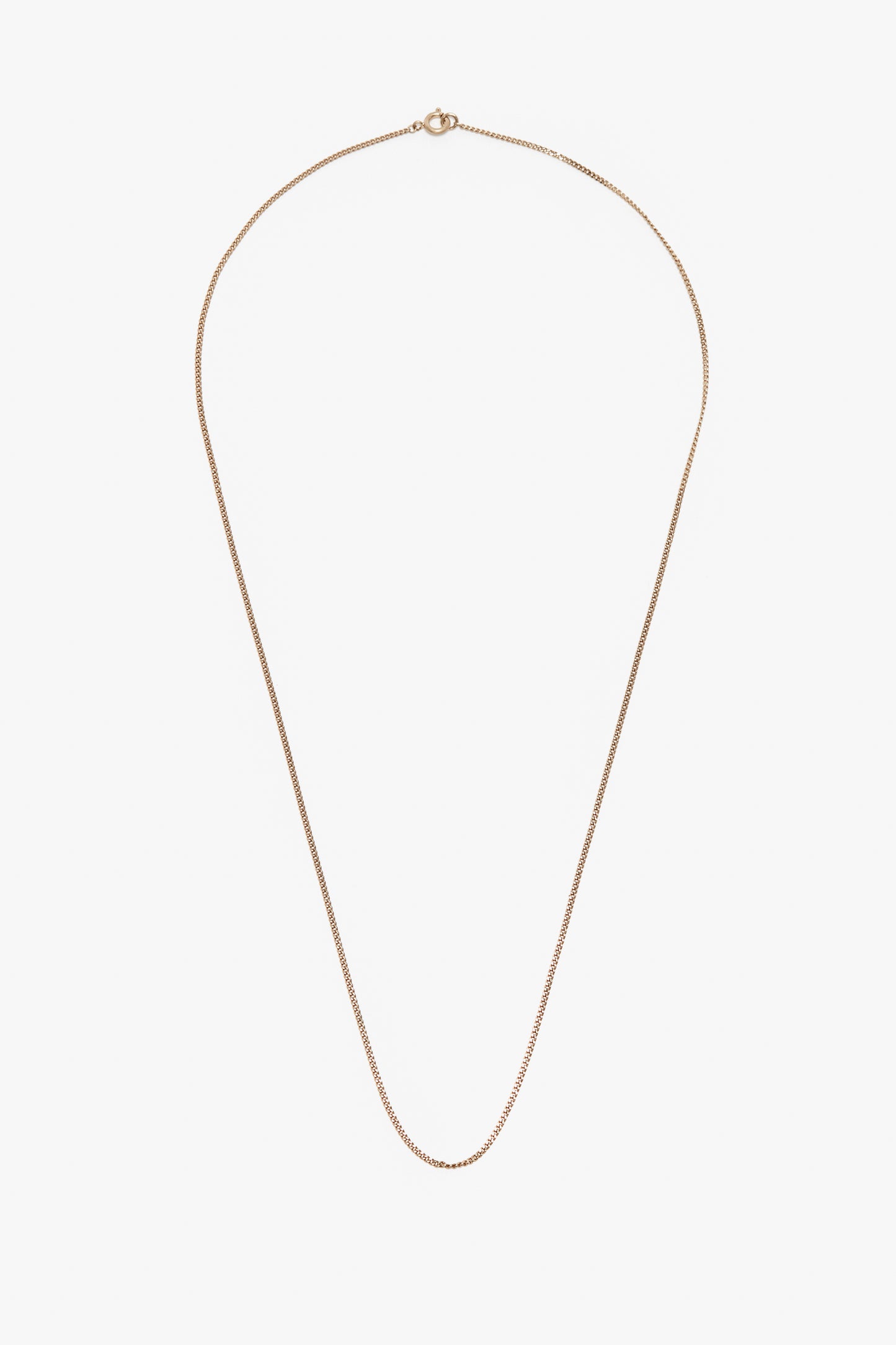 A simple gold-plated brass Victoria Beckham Exclusive Long Fine Chain In Gold with a fine link design and a small, circular clasp at the top against a white background.