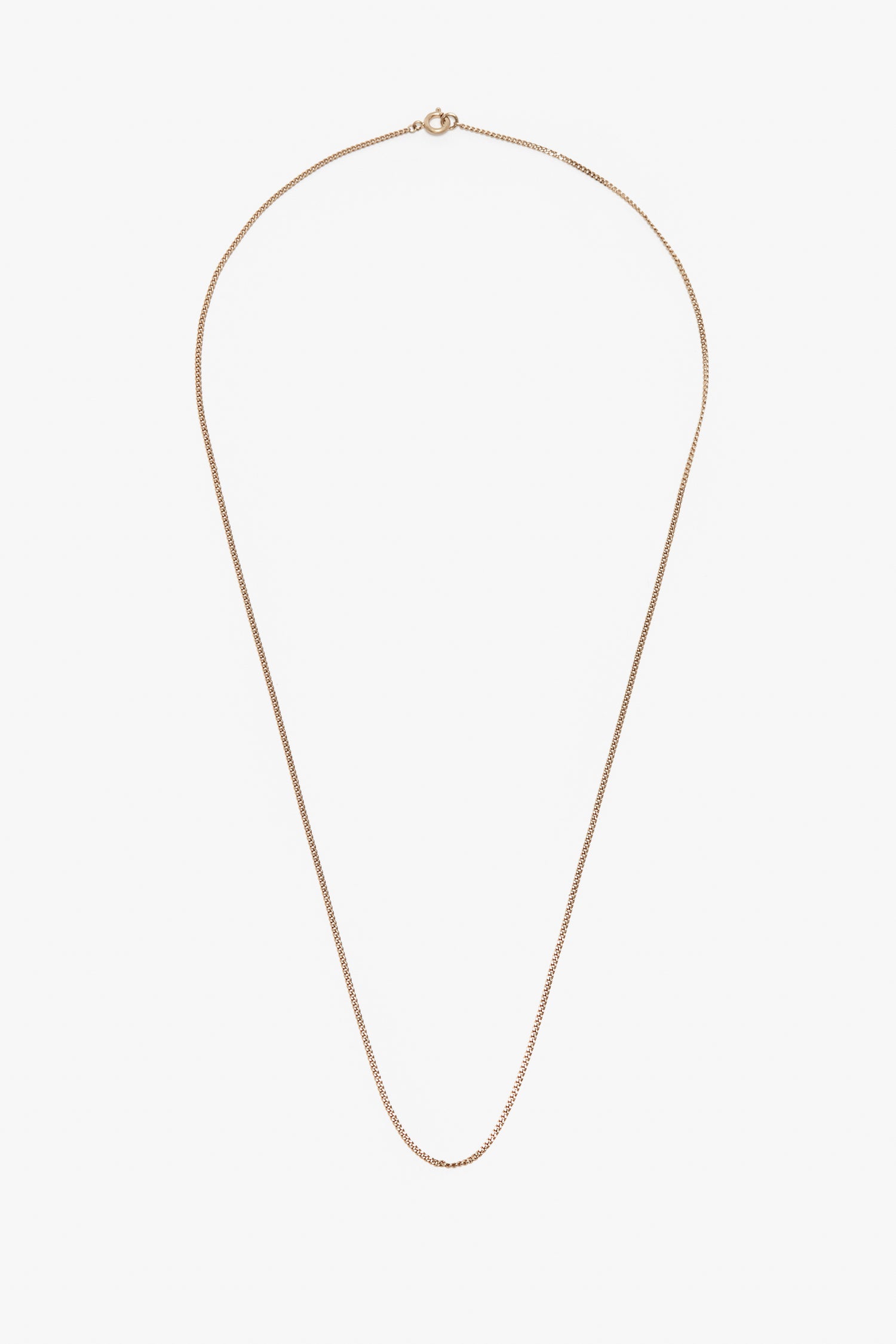 A simple gold-plated brass Victoria Beckham Exclusive Long Fine Chain In Gold with a fine link design and a small, circular clasp at the top against a white background.