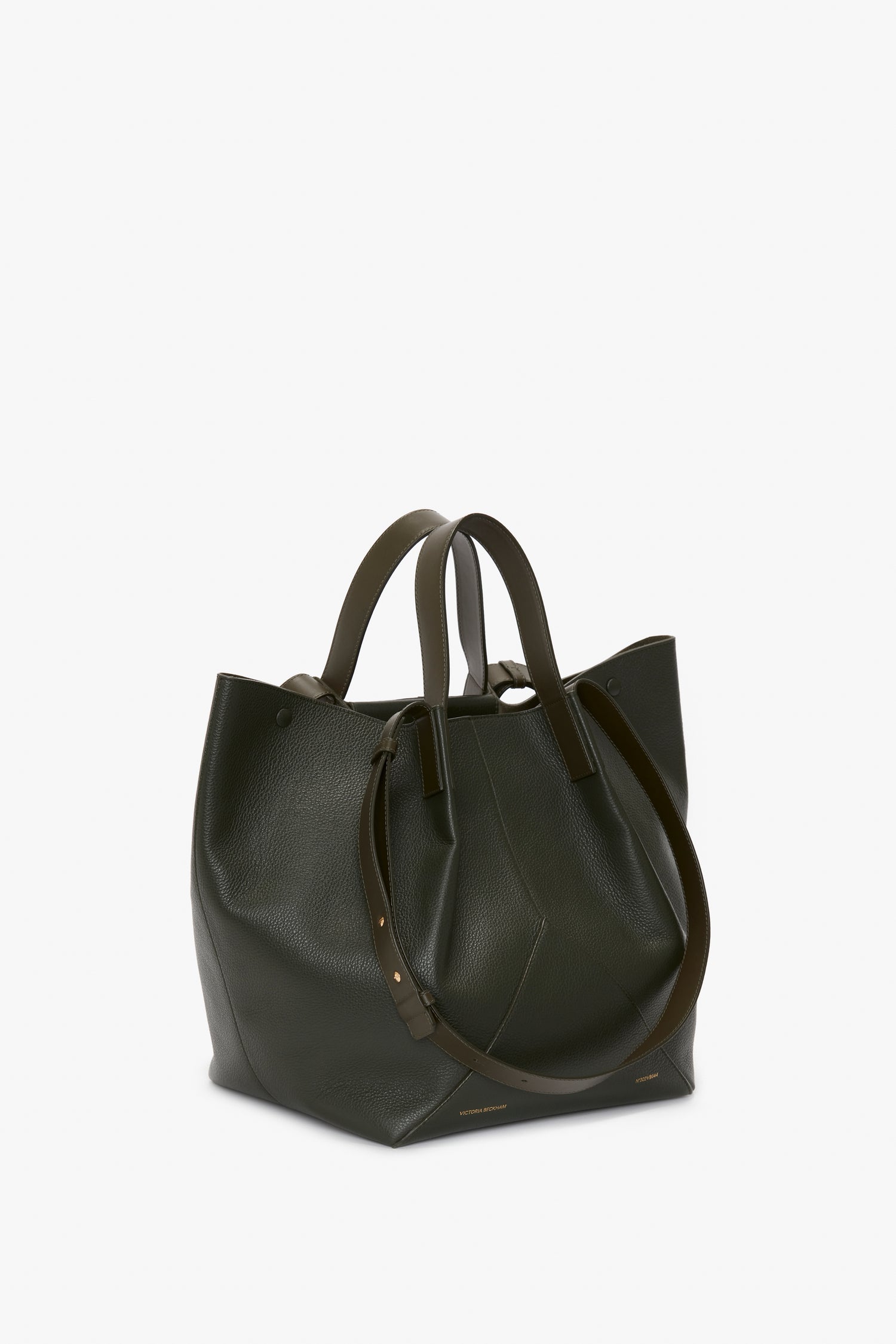 A dark green leather W11 Jumbo Tote Bag In Loden Leather by Victoria Beckham with structured sides, double handles, and an adjustable shoulder strap on a white background crafted from luxury grained leather.