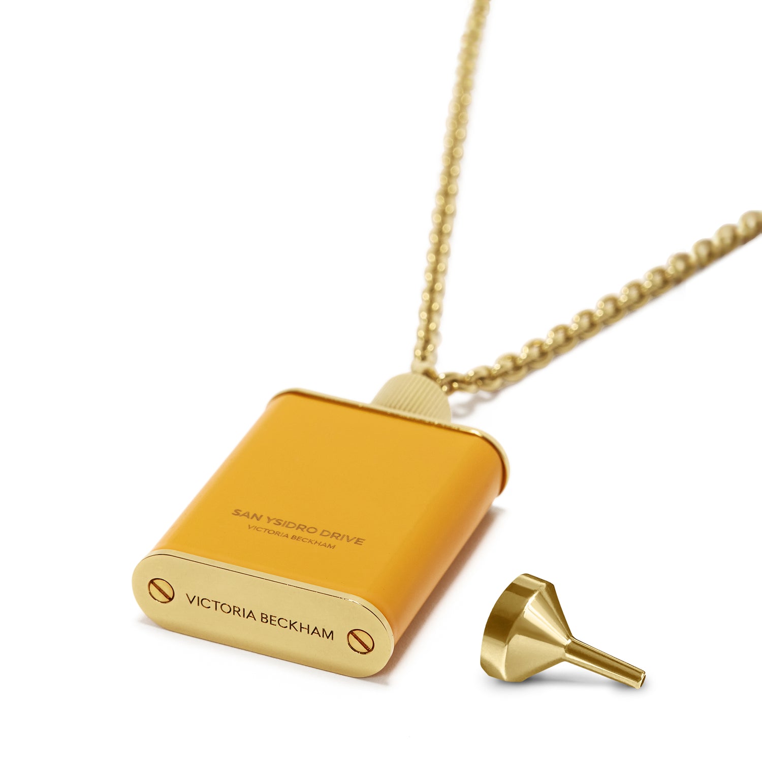 A Perfume Bottle Necklace in San Ysidro Drive featuring the Victoria Beckham branding, complemented by an accompanying tiny gold funnel. This piece of unique jewellery showcases elegance and sophistication.