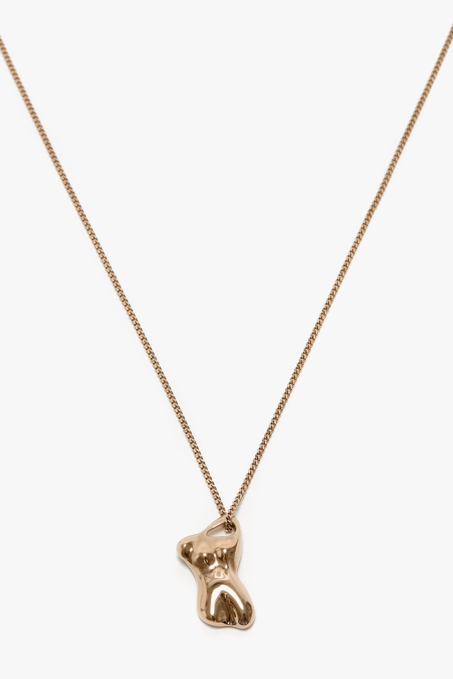 Light Gold necklace with a bear-shaped pendant on a simple chain against a white background, crafted from 100% brass, Exclusive Body Charm Necklace In Light Gold by Victoria Beckham.