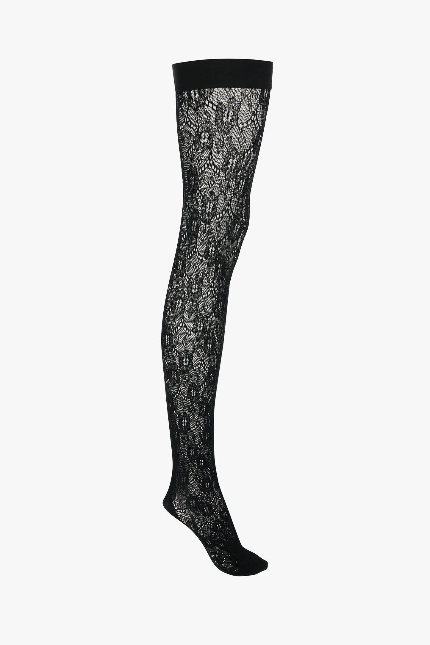 Exclusive VB Monogram Lace Hold-Ups In Black by Victoria Beckham, with a solid top band and sheer finish, displayed against a white background.