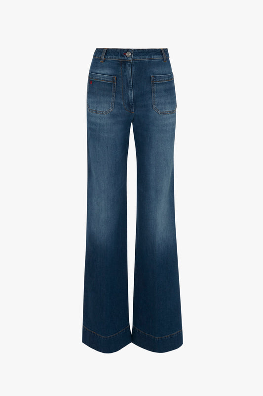 A pair of dark blue, high-waisted wide-leg Alina High Waisted Jean in Dark Vintage Wash by Victoria Beckham with two back pockets and visible stitching.