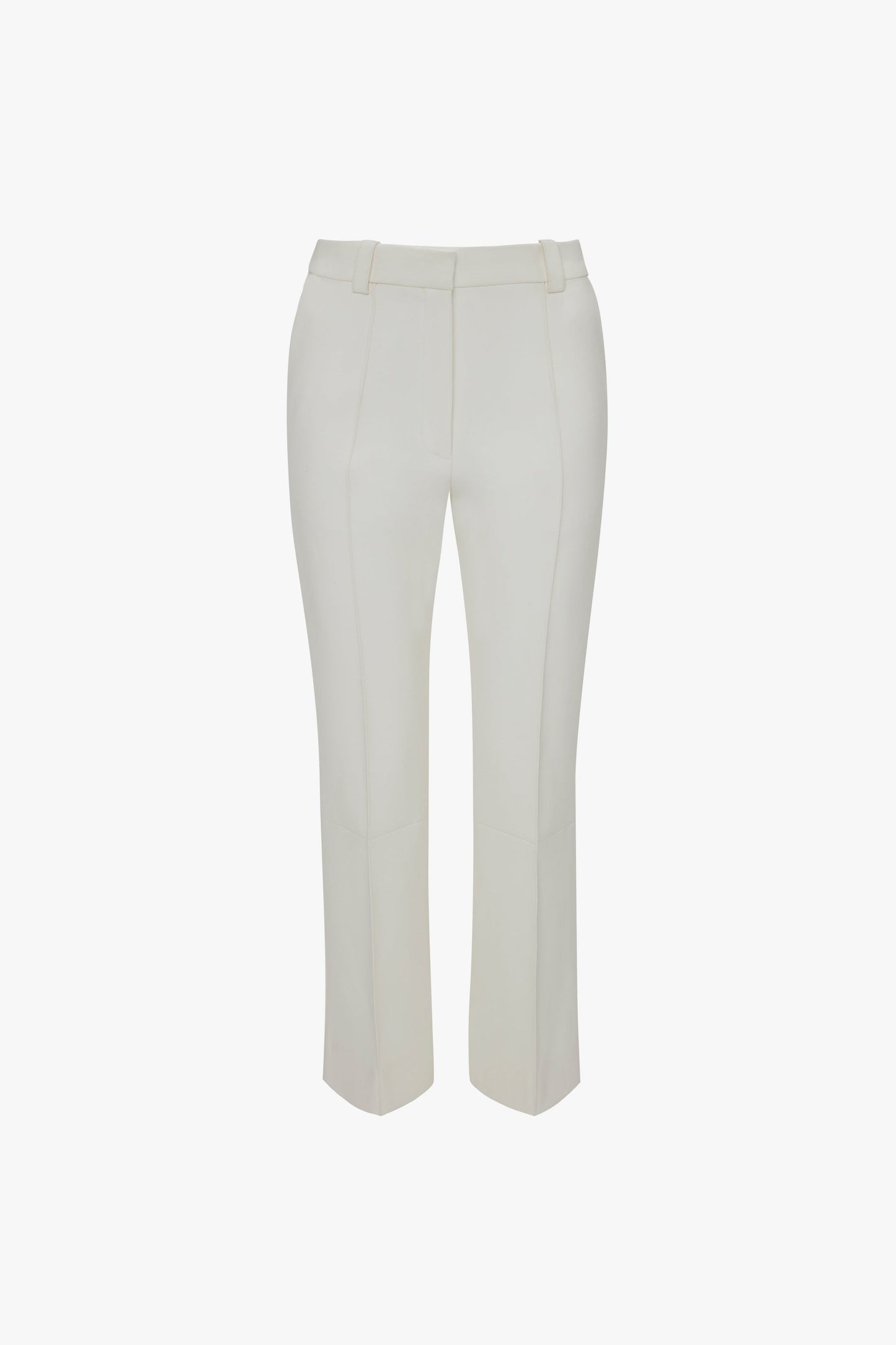 A pair of Cropped Kick Trousers In Ivory by Victoria Beckham with belt loops and stitched seams, shown flat on a white background.