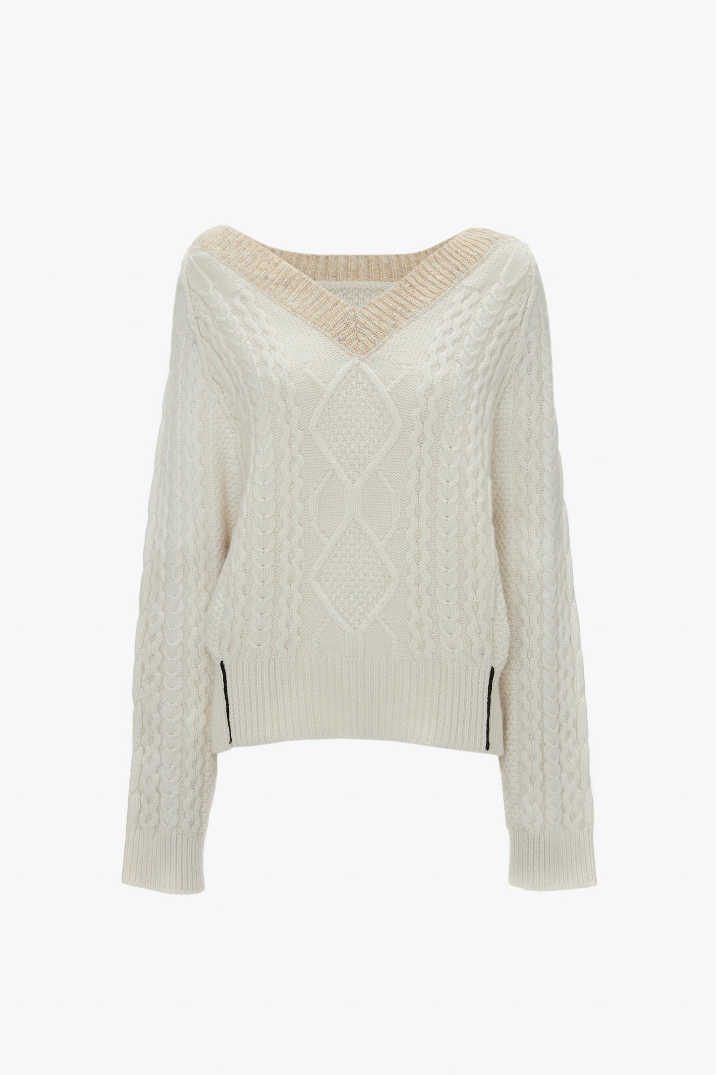 Cream V-neck jumper with a traditional cable knit design and long sleeves. Crafted from pure lambswool, the Victoria Beckham V-Neck Jumper In Natural features intricate patterns and details throughout.