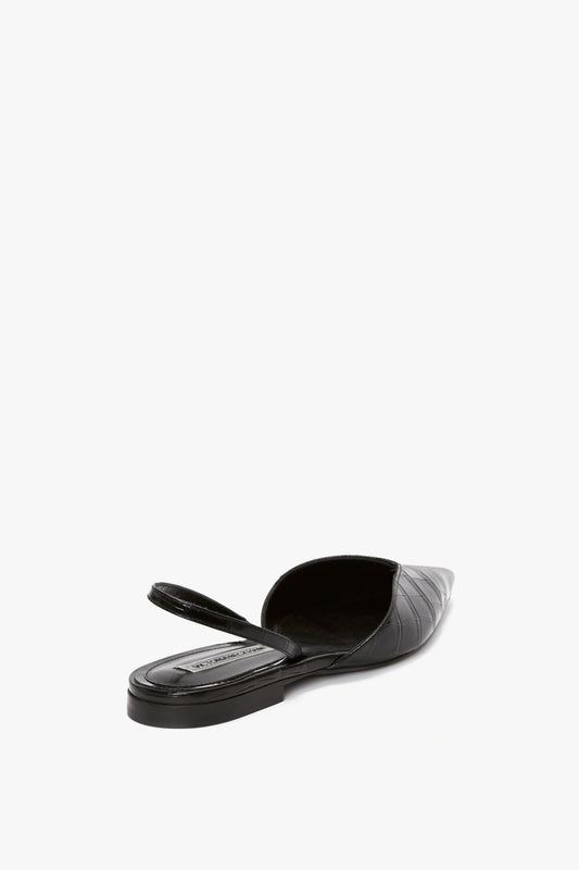 Black, pointed-toe V Cut Sling Back In Black Croc-Effect Leather by Victoria Beckham, featuring an asymmetric V cut and a single rear strap, viewed from the back on a white background.