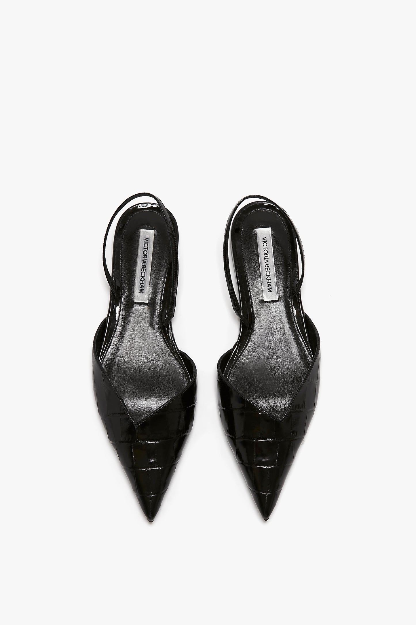 A pair of Victoria Beckham V Cut Sling Back In Black Croc-Effect Leather shoes, placed side by side on a white background.