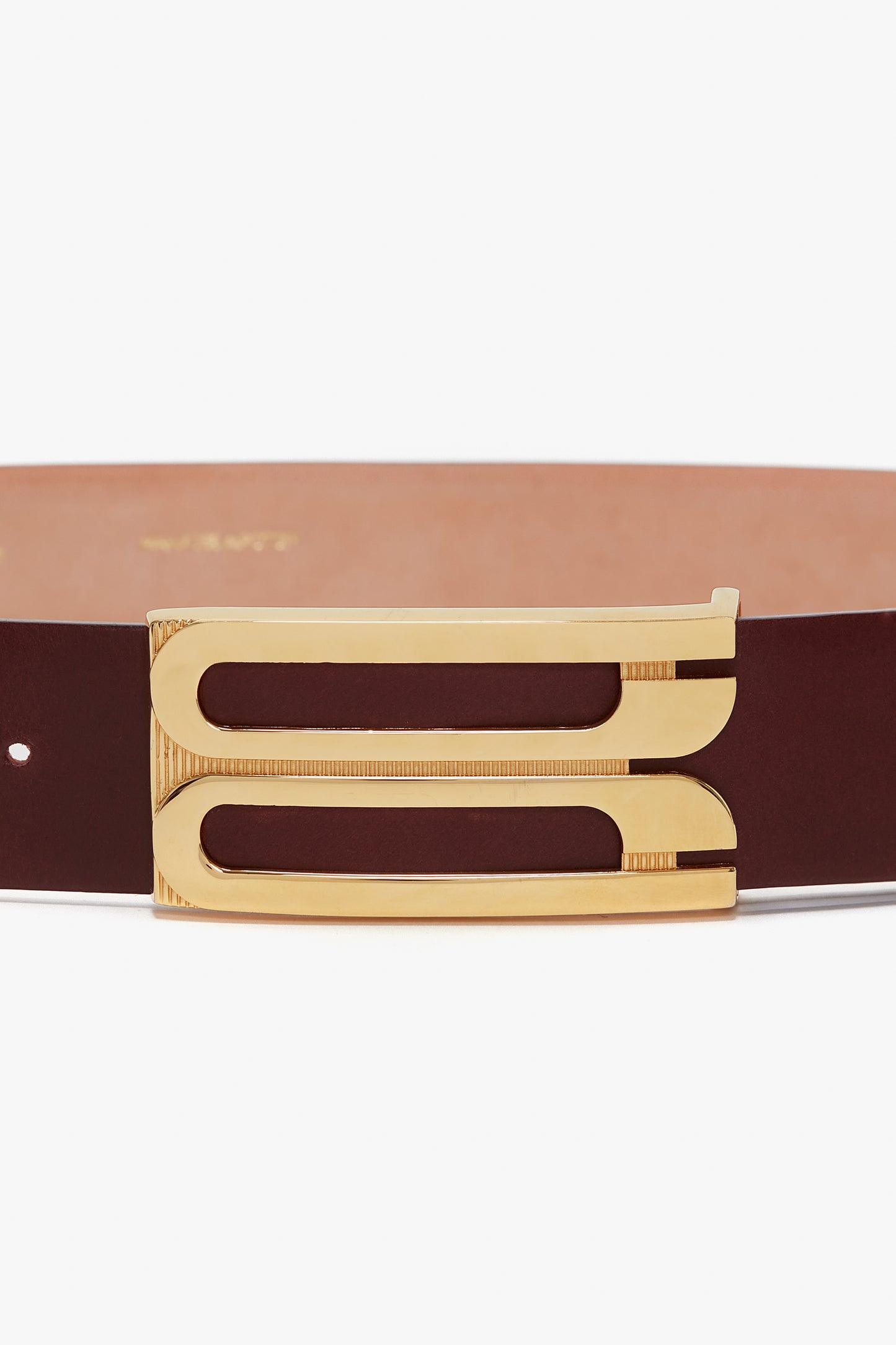 A smooth calf leather Jumbo Frame Belt In Burgundy Leather by Victoria Beckham featuring a distinctive gold rectangular buckle with two parallel openings.