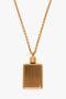 Exclusive Perfume Bottle Necklace In Brushed Gold by Victoria Beckham with a textured surface, crafted in gold brushed brass, attached to a matching chain.