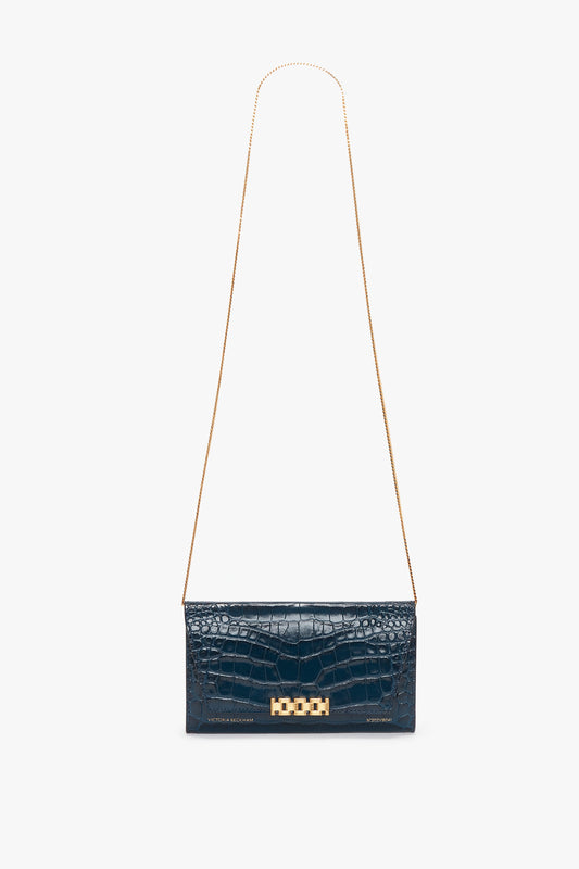 A Wallet On Chain In Midnight Croc-Effect Leather, Victoria Beckham embossed croc leather handbag with a long gold chain strap and a rectangular gold clasp.