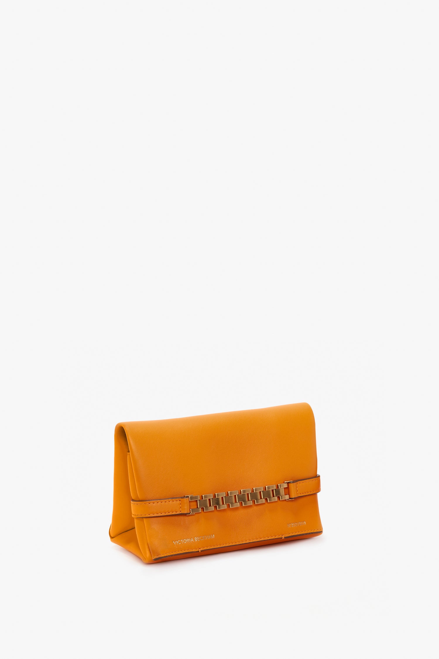 A small, rectangular bright mandarin Mini Chain Pouch Bag With Long Strap In Mandarin Leather with a mini chain pouch accent on the front and the brand name "Victoria Beckham" inscribed at the bottom corner.