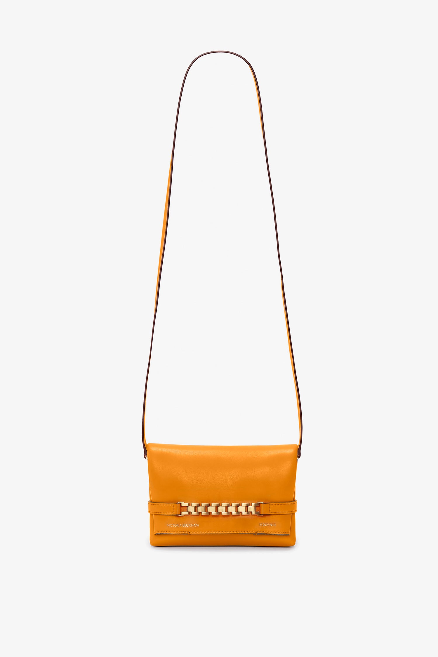 A bright mandarin structured leather shoulder bag featuring a long strap and a decorative metal chain detail on the front, perfect as the Mini Chain Pouch Bag With Long Strap In Mandarin Leather by Victoria Beckham for your essentials.