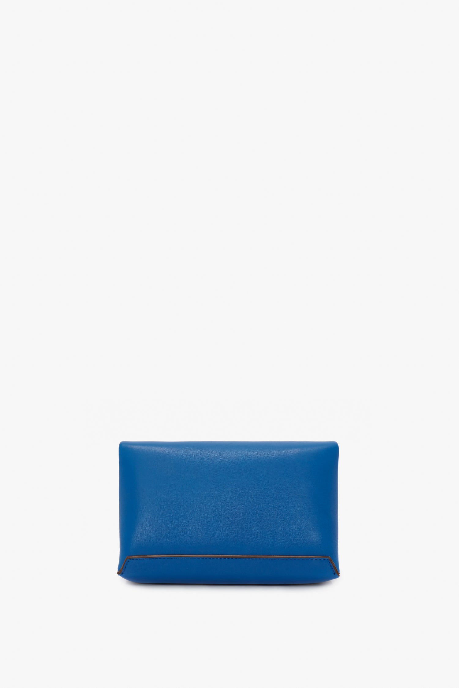 A Victoria Beckham Mini Chain Pouch Bag With Long Strap In Sapphire Blue with a smooth texture and minimal design against a white background.