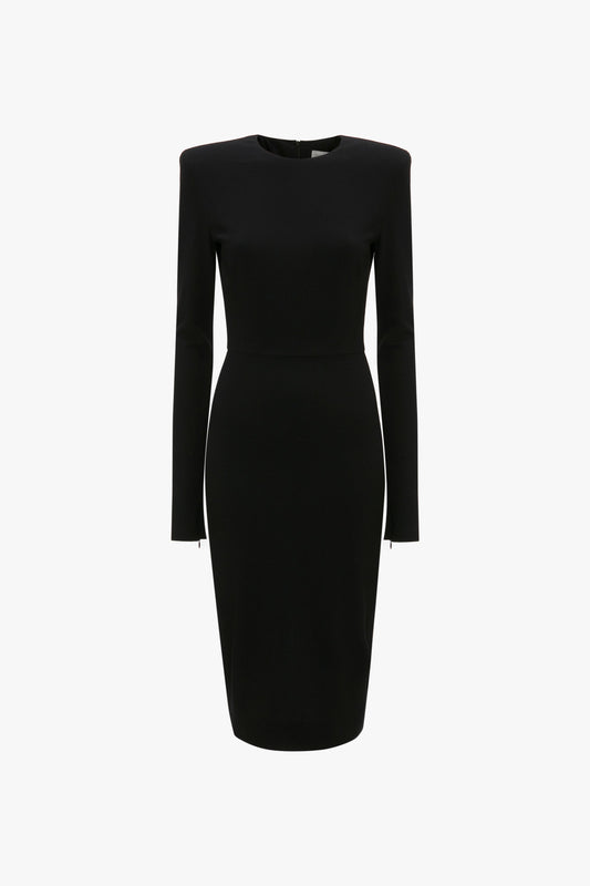 A black, knee-length, long-sleeve Victoria Beckham Long Sleeve T-Shirt Fitted Dress In Black with a fitted silhouette and padded shoulders, made from bi-stretch crepe on a plain white background.