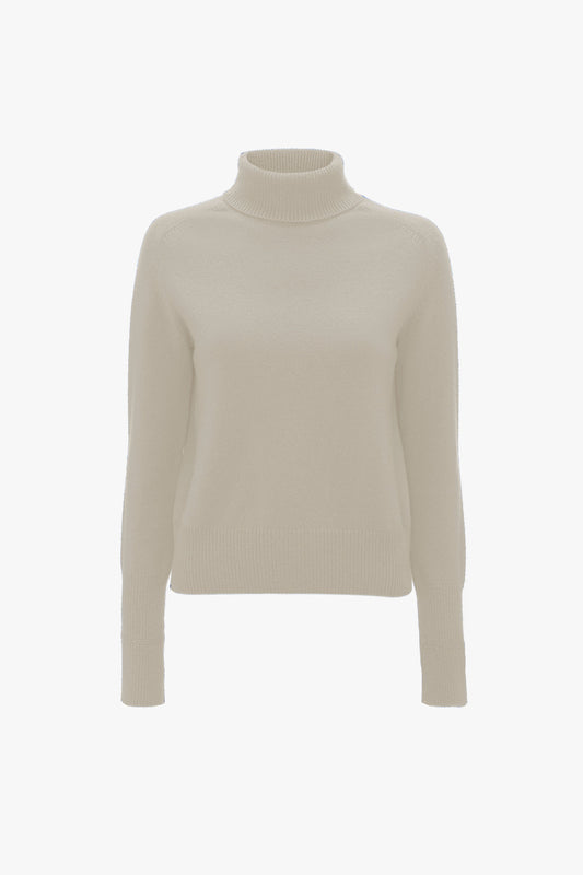 A Victoria Beckham Polo Neck Jumper In Ivory displayed on a white background.