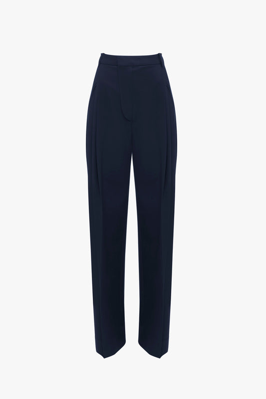 A Victoria Beckham Wide Leg Trouser In Midnight with pleated front legs and a high waist, shown against a white background.