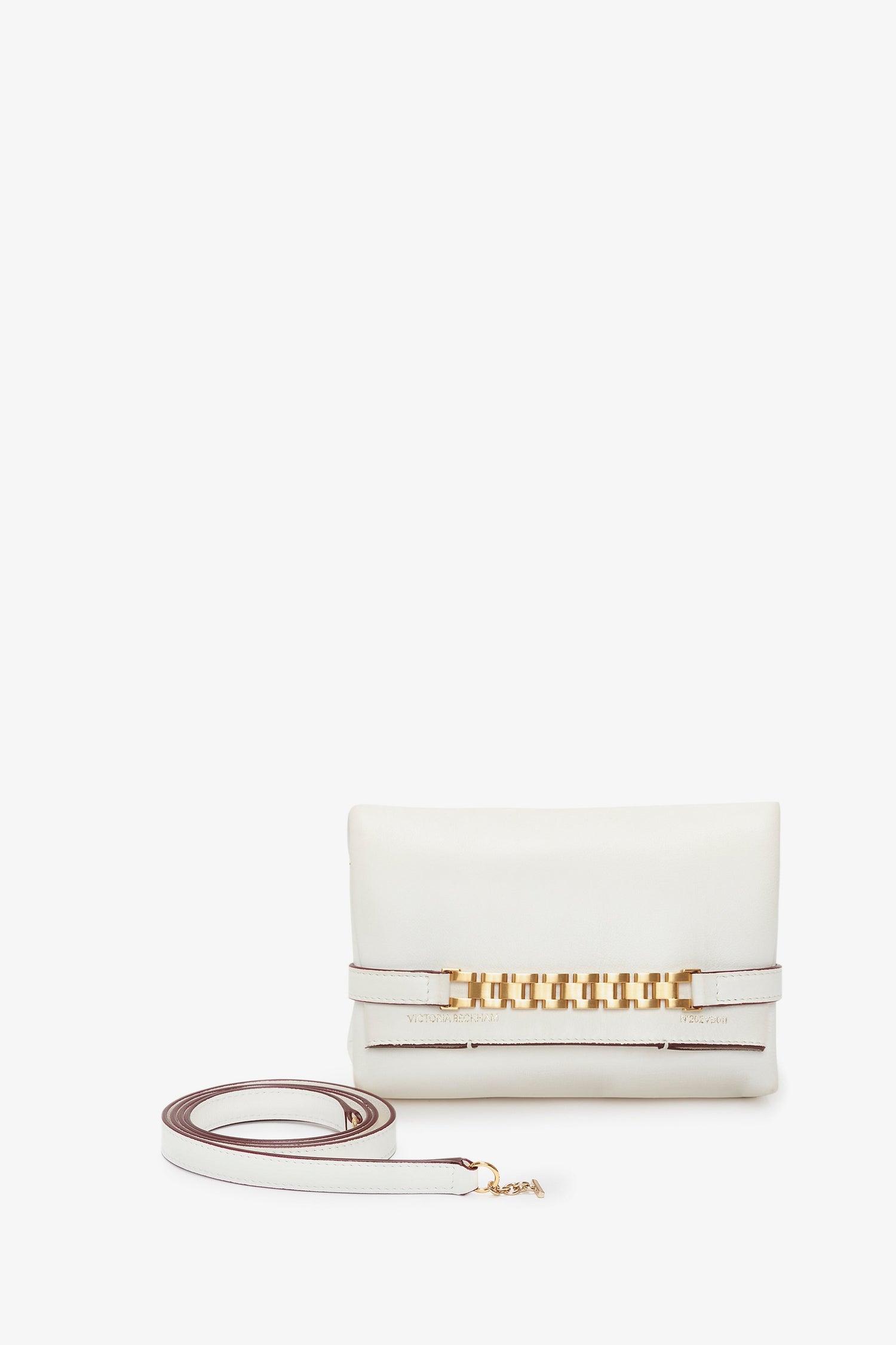 A Mini Chain Pouch Bag With Long Strap In White Leather with a Victoria Beckham-inspired design, featuring a detachable strap and gold chain detail along the front.