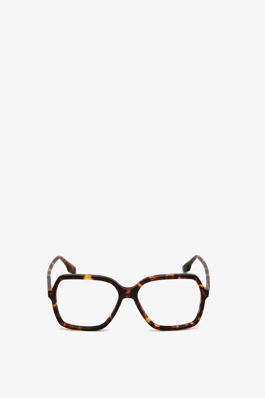 A pair of Guilloche Frame Opticals In Dark Havana tortoise acetate rectangular eyeglasses with wide frames on a white background, crafted by Victoria Beckham.